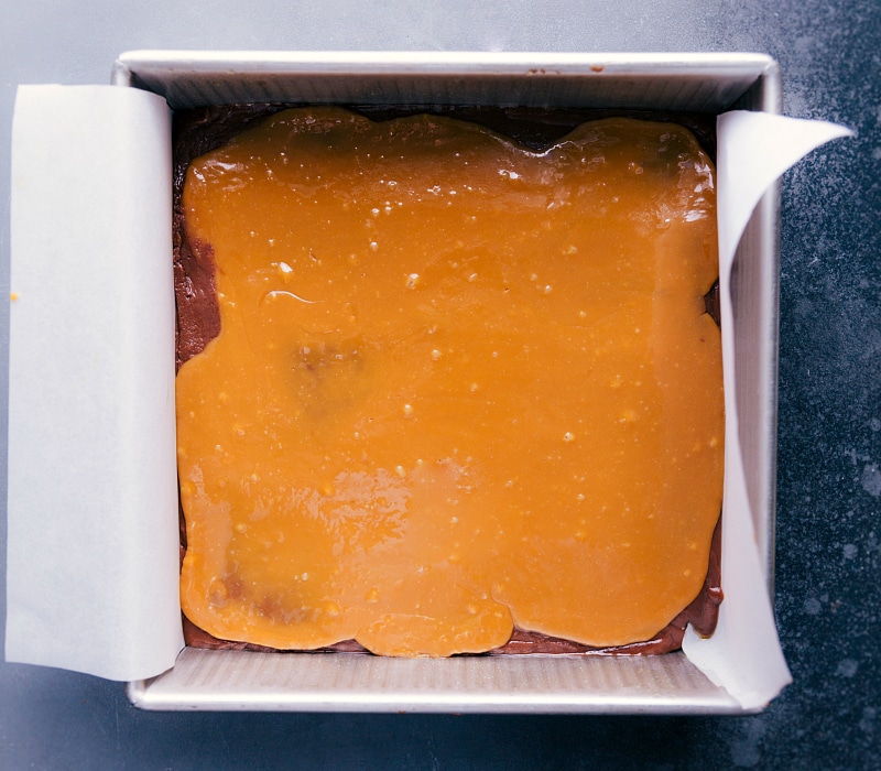 Overhead image of Microwave Fudge with caramel spread evenly on top.