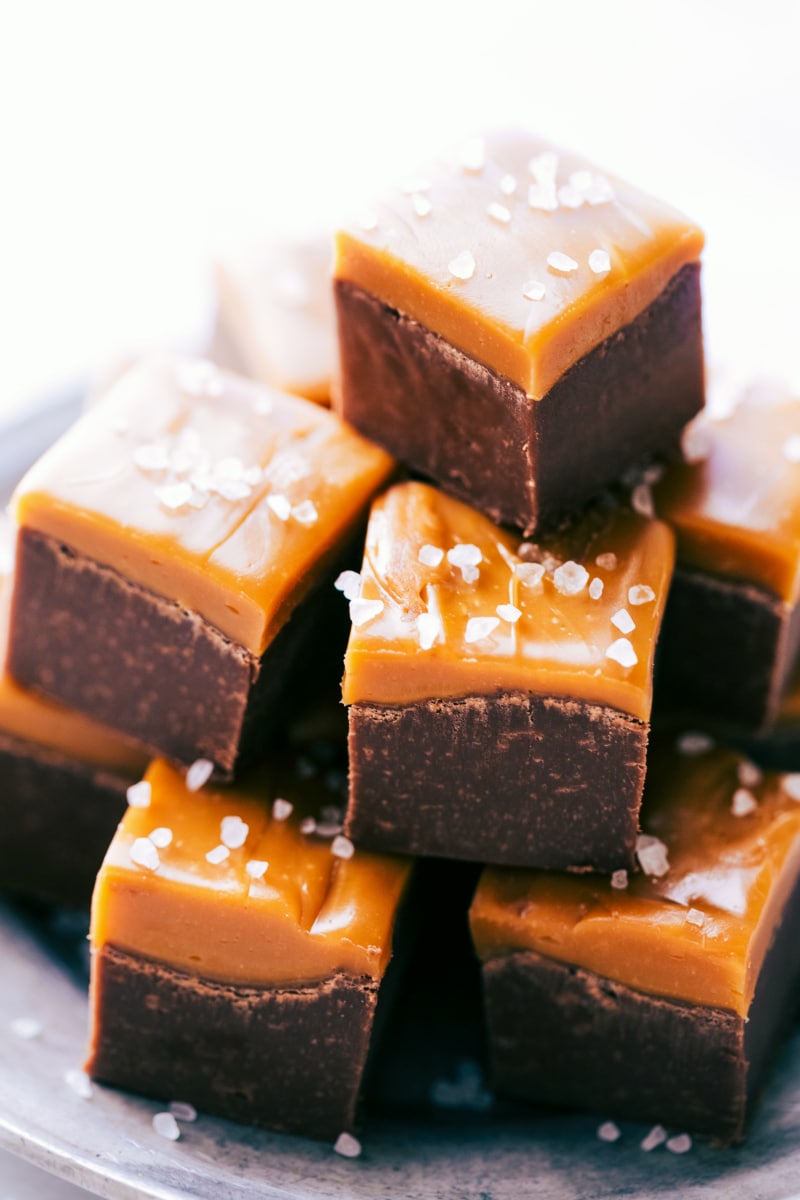 Image of Microwave Fudge pieces stacked on top of each other ready to be eaten.