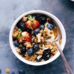 Almond granola in a yogurt bowl, a scrumptious breakfast ready to be enjoyed.