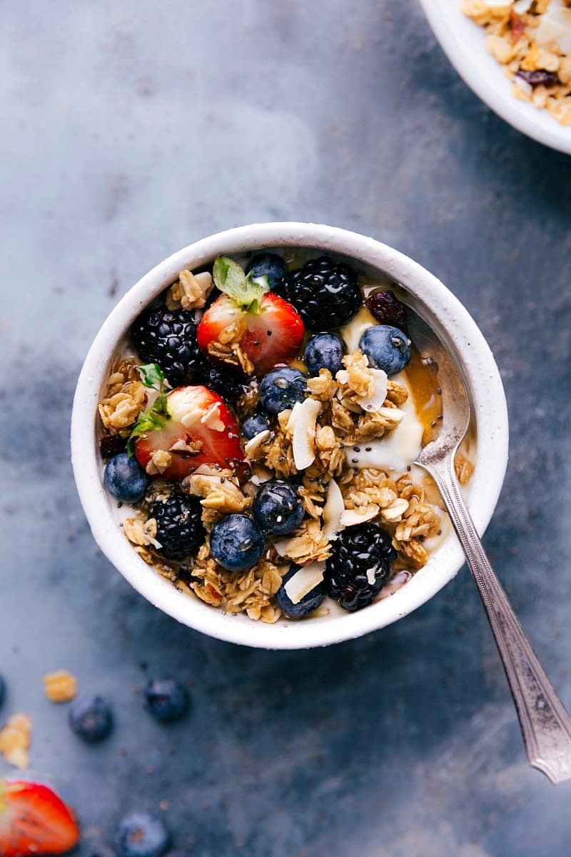 Overhead image of Almond Granola in a yogurt bowl ready to be eaten.