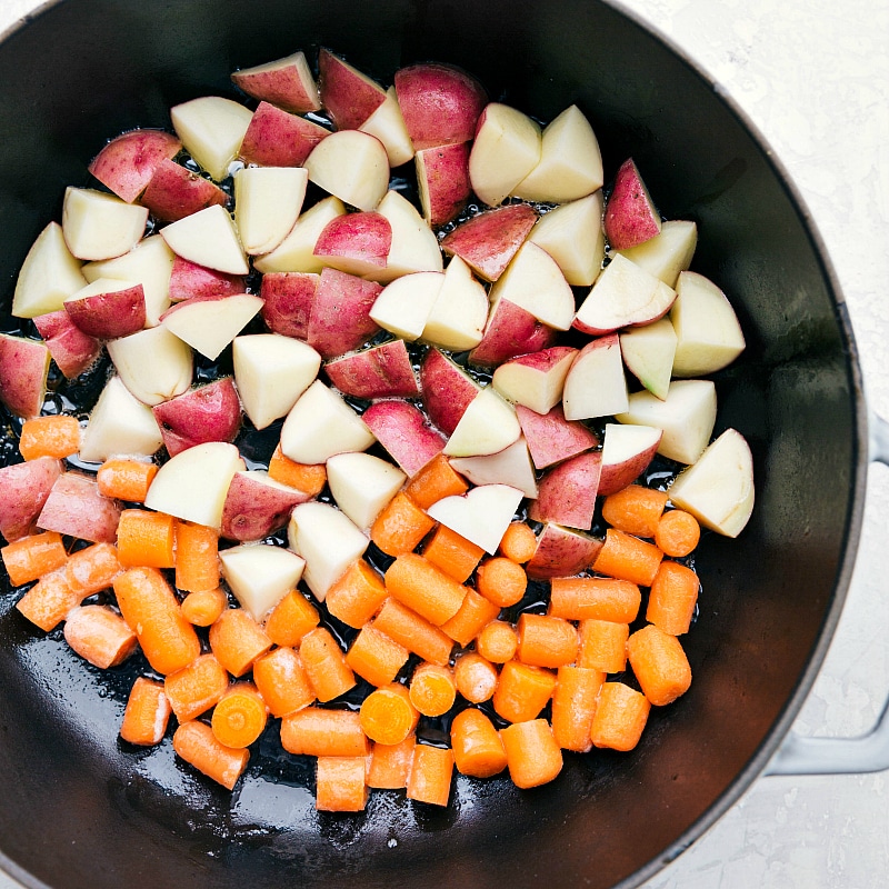 Potatoes and carrots in a skillet