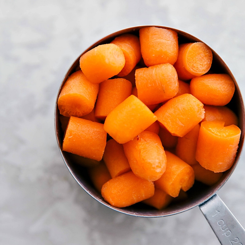 Chopped carrots in a measuring cup