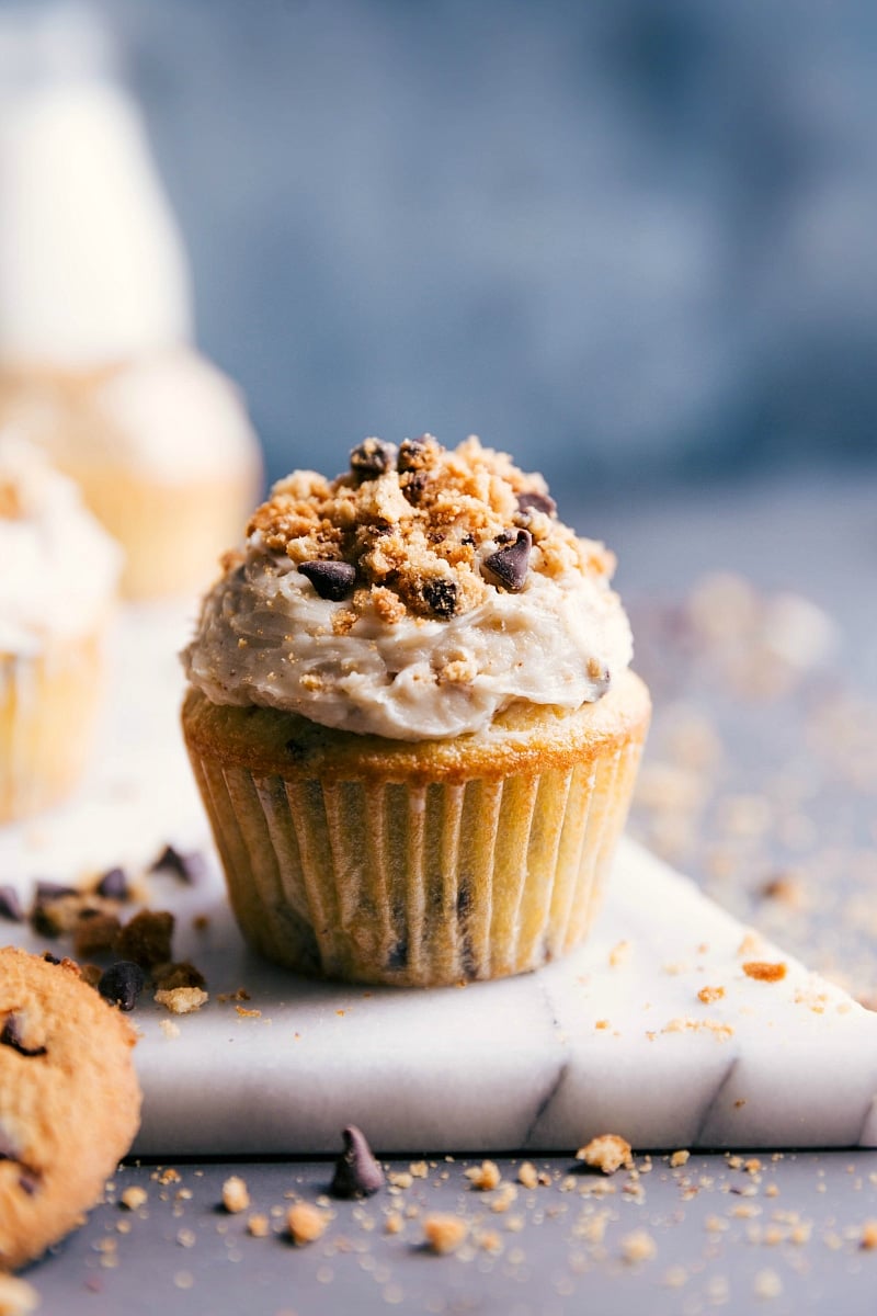 Image of a Chocolate Chip Cupcake sitting on a marble board.