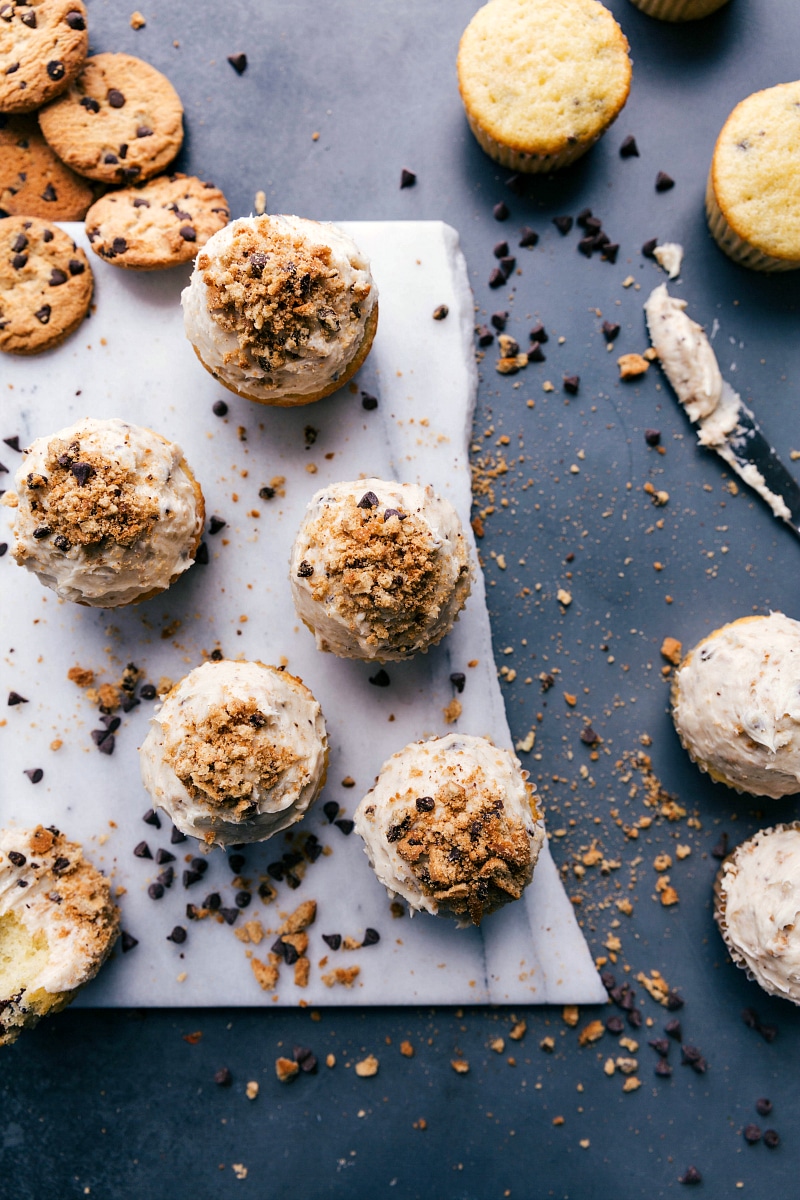 Overhead view of Chocolate Chip Cupcakes, surrounded by cookies and chocolate chips.