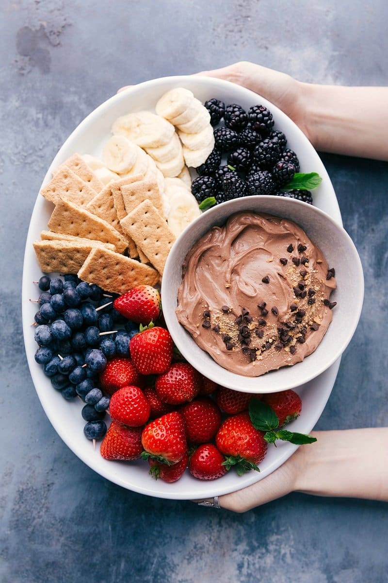 Overhead image of Chocolate Dip for Fruit with fresh blackberries, blueberries, strawberries, bananas, and graham crackers.