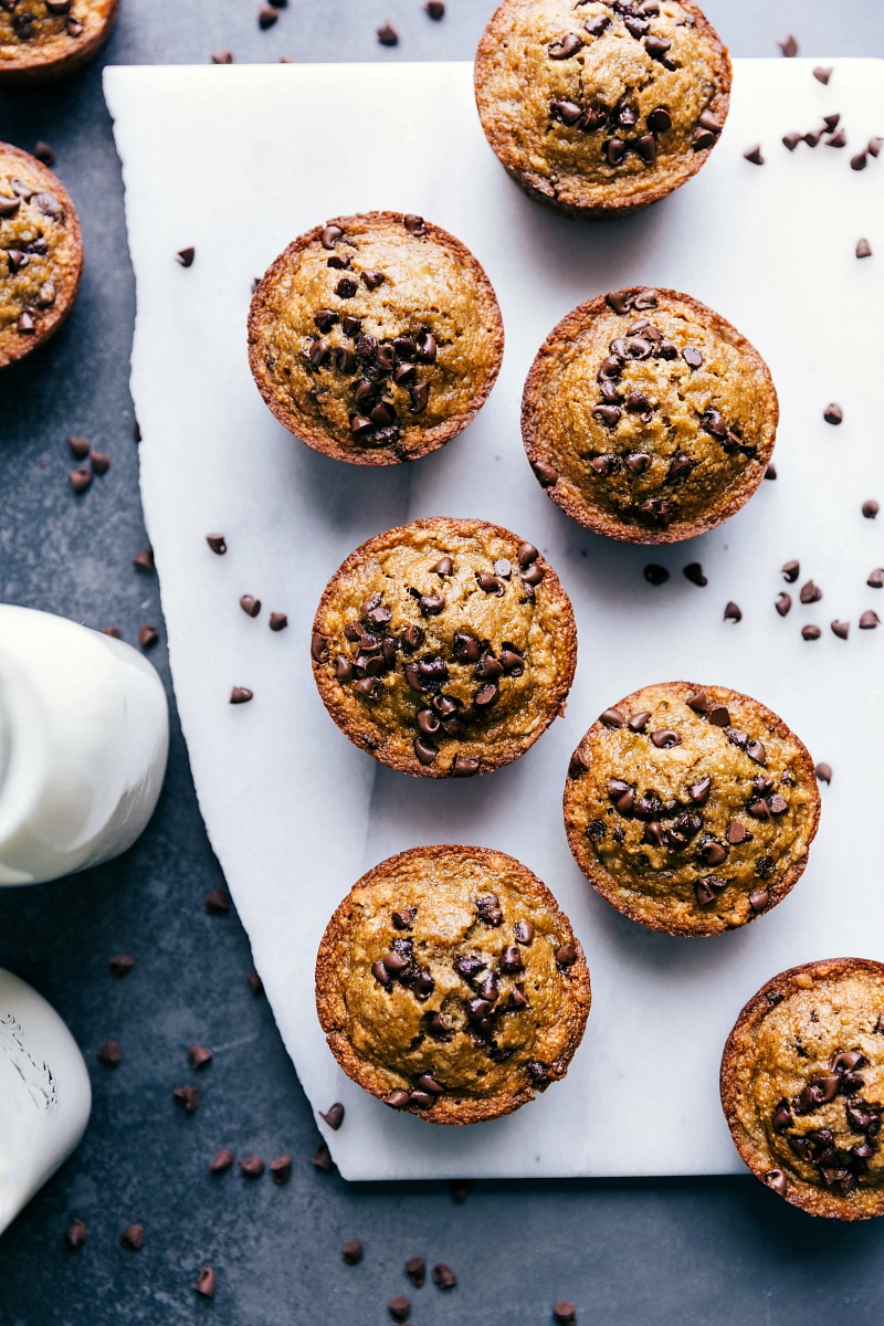 Overhead image of Flourless Banana Muffins on a counter, fresh out of the oven and ready to be eaten.