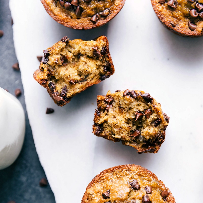 A finished, healthy yet sweet breakfast pastry, broken in half to reveal its fluffy interior with melted chocolate chips, ready for eating.