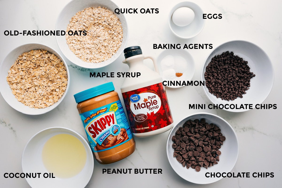 Ingredients In Healthy Oatmeal Chocolate Chip Cookies All the ingredients in this recipe prepped out for easy assembly including the oats, oil, peanut butter, chocolate, cinnamon, baking agents, and eggs.