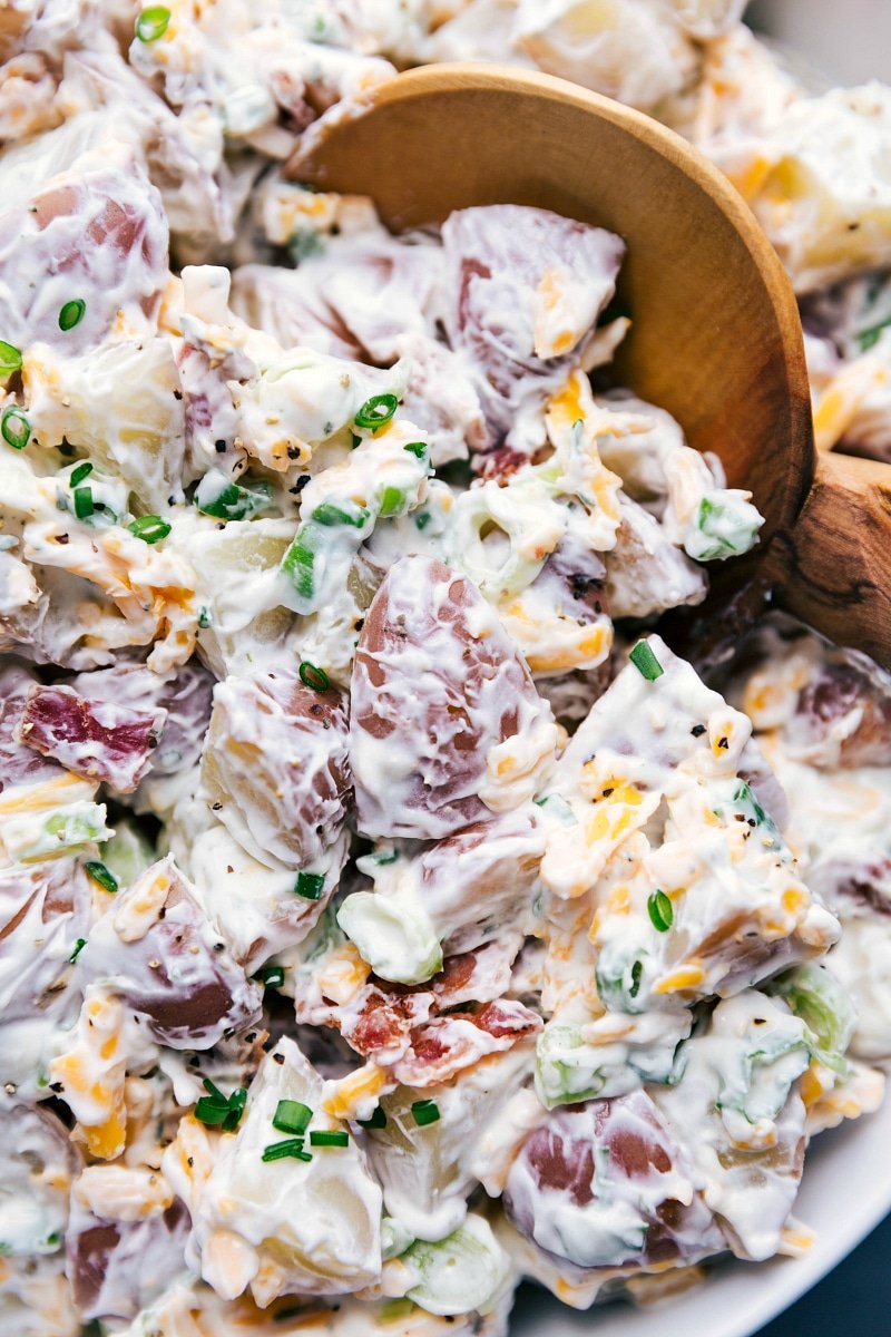 Up-close overhead image of Ranch Potato Salad with a spoon in it, about to be served.