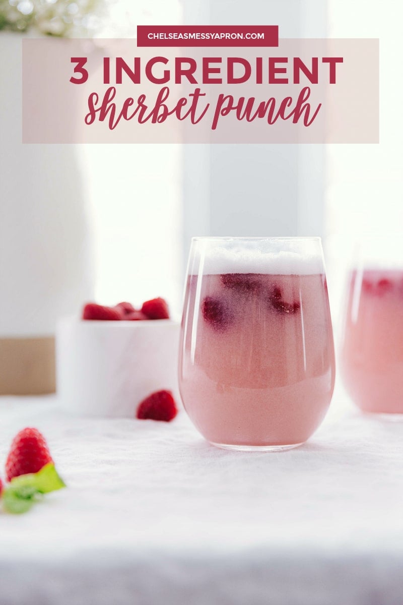 Photo of two glasses of Sherbet Punch with raspberry garnishes.