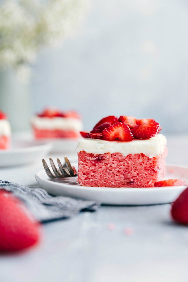 A slice of Strawberries and Cream Cake on a plate