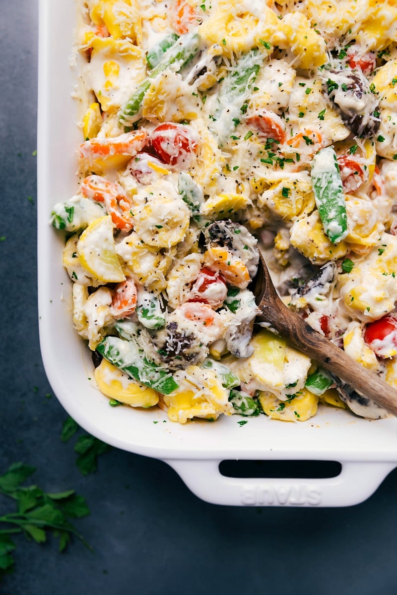 The finished tortellini casserole, delicious and cheesy, bursting with color and flavor.