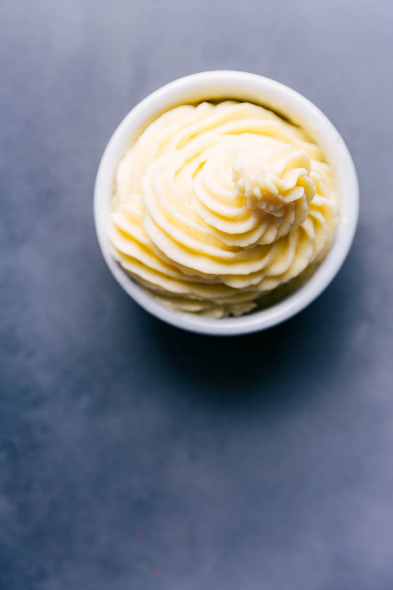 Bowl of homemade dole whip, fluffy and sweet, tempting the taste buds.