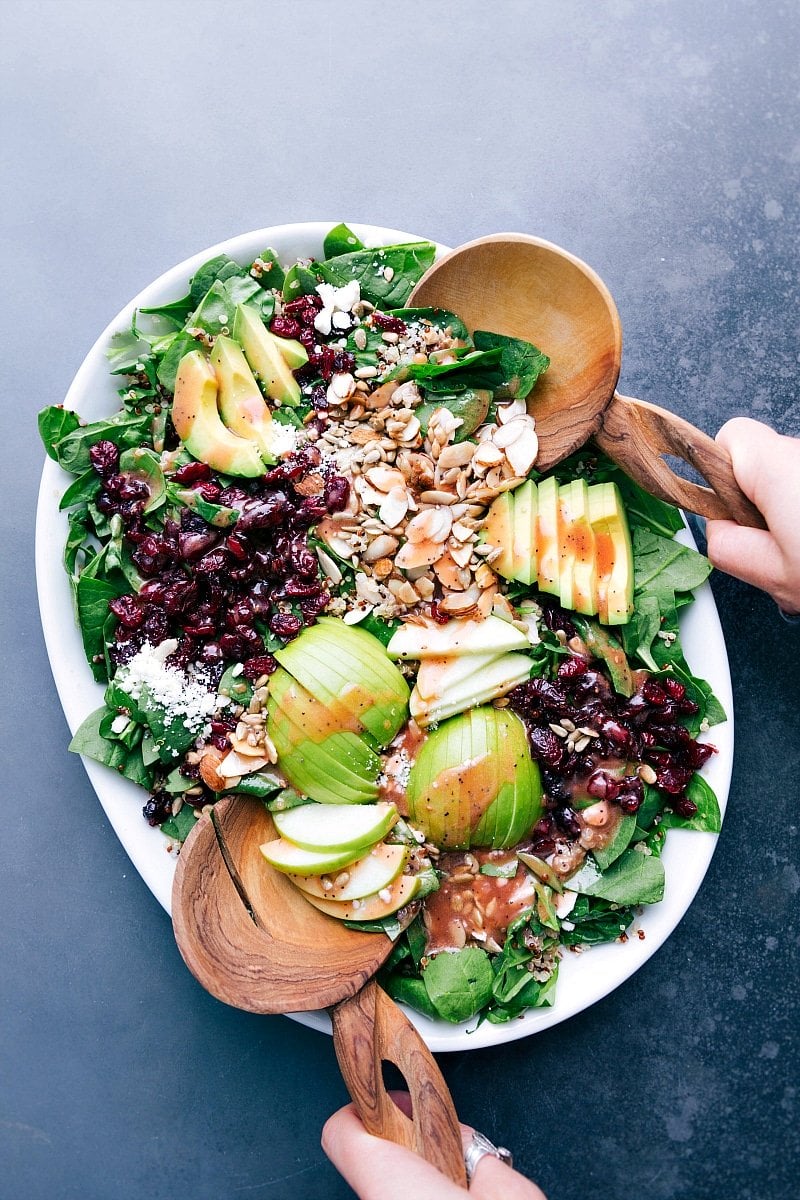 Quinoa and almond salad ready to be tossed together, all the fresh ingredients delicious and complimentary.