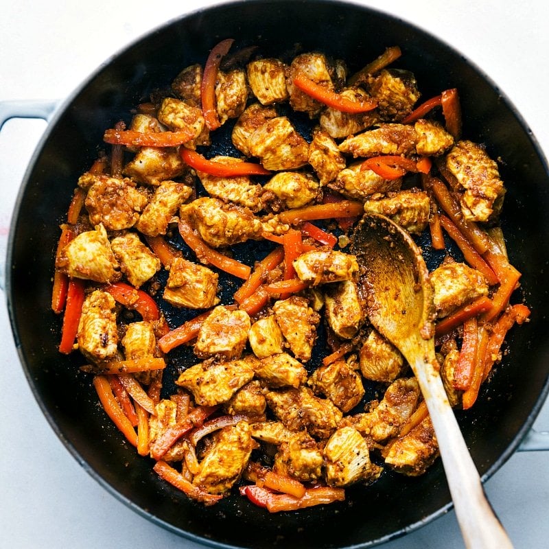 Image of the chicken and red peppers in the pan for Coconut Curry Chicken.