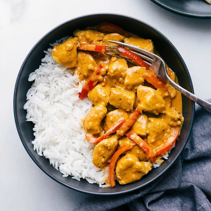 The finished meal served over a bed of rice, warm, flavorful, and ready to be enjoyed.