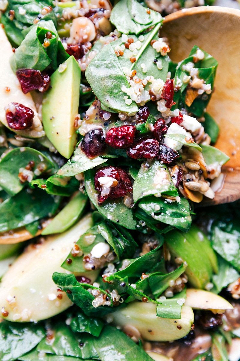 Quinoa and almond salad mixed together, deliciously dressed with all the complementary ingredients.