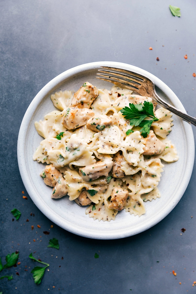 Overhead image of the chicken Alfredo on a plate, with a fork on the side.