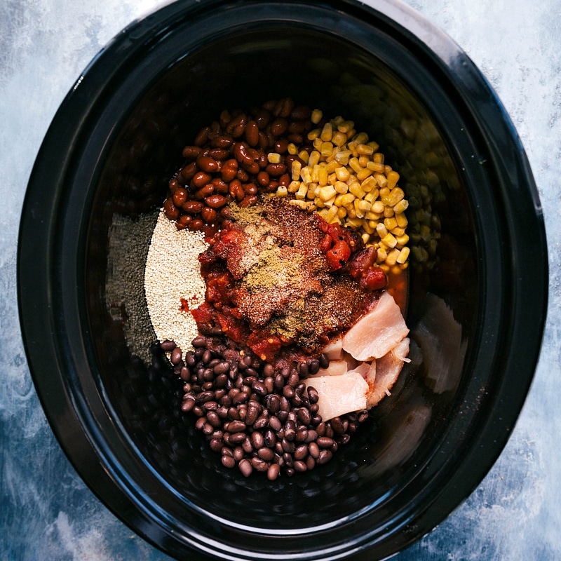 Overhead image of all the ingredients in the slow cooker, ready to be cooked for this chili.