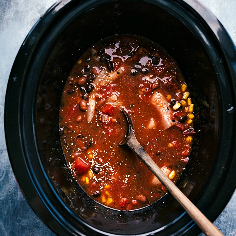 All ingredients mixed together in the slow cooker, ready to be cooked.