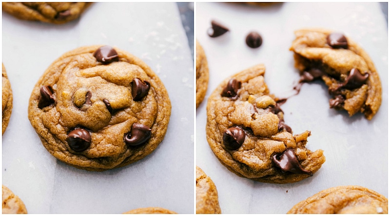 Freshly baked chocolate chip pumpkin cookies with one cookie split in half, revealing its soft interior.