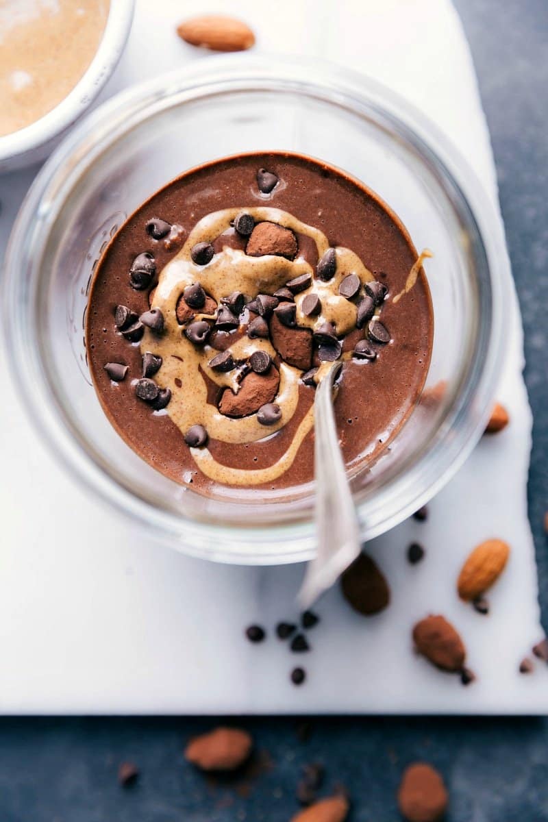 Overhead image of Chocolate Almond Overnight Oats with a spoon in them.