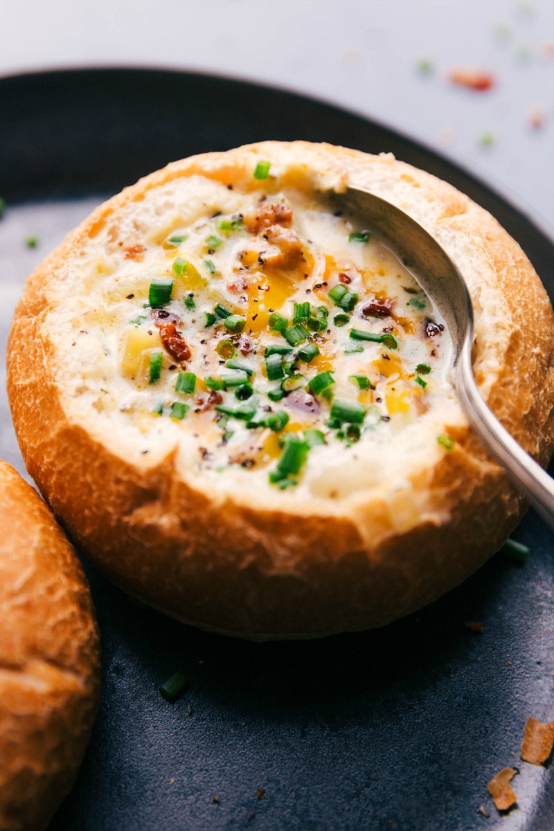 Overhead image of the dish in a bread bowl with a spoon in it