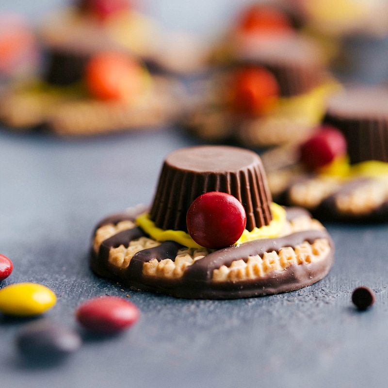 Creative pilgrim hats crafted from cookies and candy, a playful addition for your Thanksgiving menu ideas.