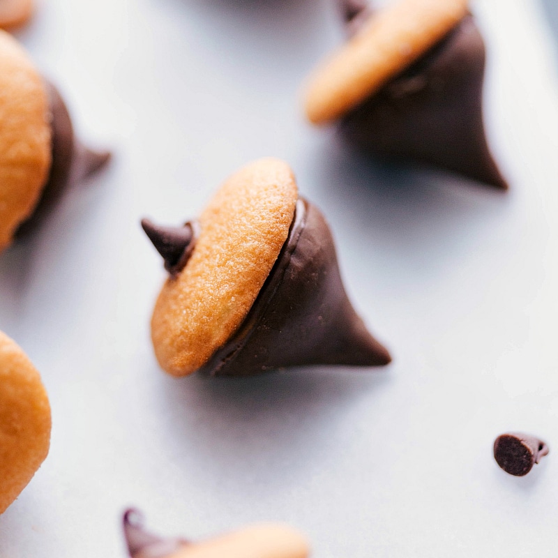 Festive acorns made with chocolate kisses and vanilla wafers.