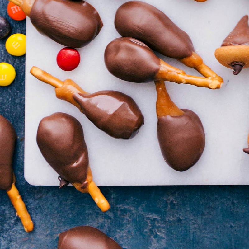 Candy turkey legs made with pretzels, caramel, and chocolate.