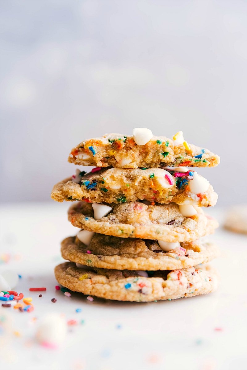 A stack of Cake Batter Cookies with one broken open.