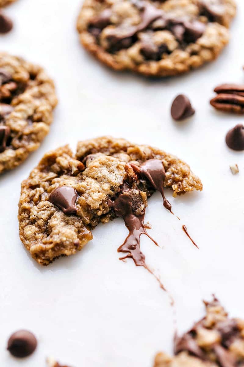 Picture of an Oatmeal Pecan Cookie split in half to see the gooey chocolate center.