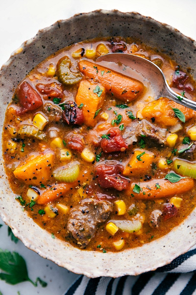 A bowl filled with the finished sweet potato beef stew, piping hot and ready to be savored, making it the perfect meal to warm you up on any day.