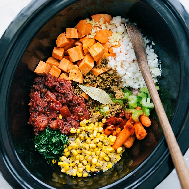 All the ingredients required for making beef stew with sweet potatoes neatly placed into the slow cooker, ready to be cooked to perfection.