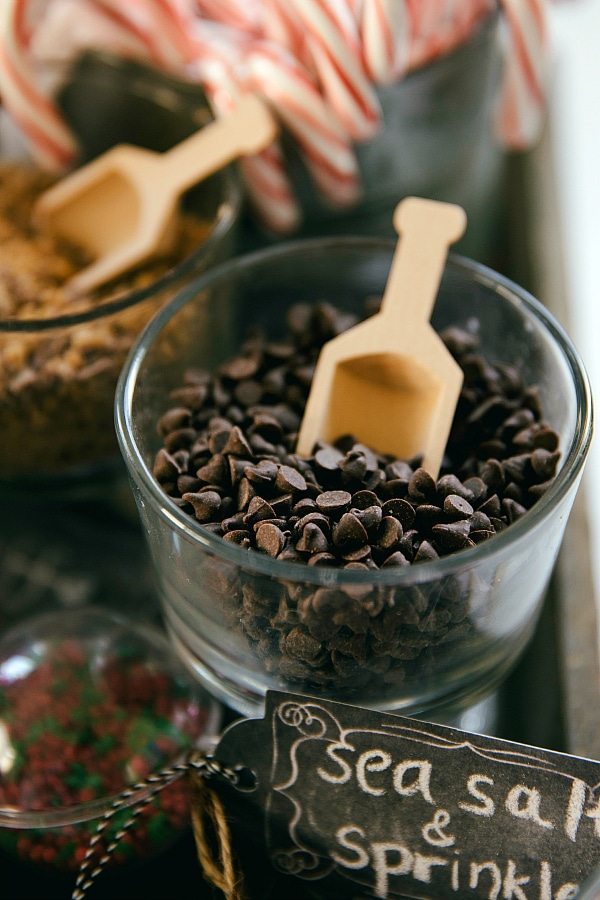 Miniature chocolate chips with a wooden scoop
