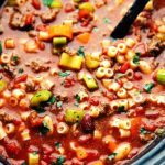 A delicious and hearty slow cooker pasta, vegetable, and ground beef soup copycatting the famous "Olive Garden" Pasta fagioli.