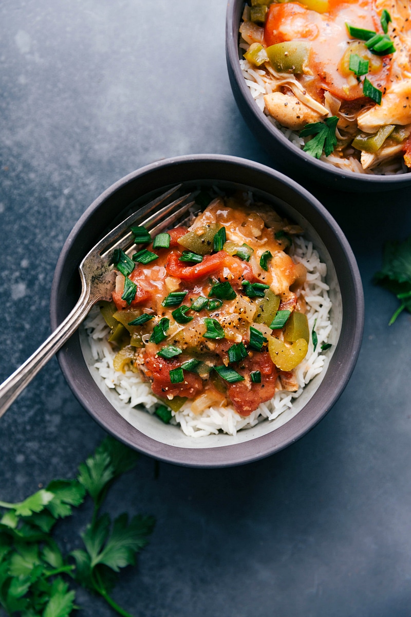 Overhead image of Crockpot Cajun Chicken in a bowl with a fork in it.