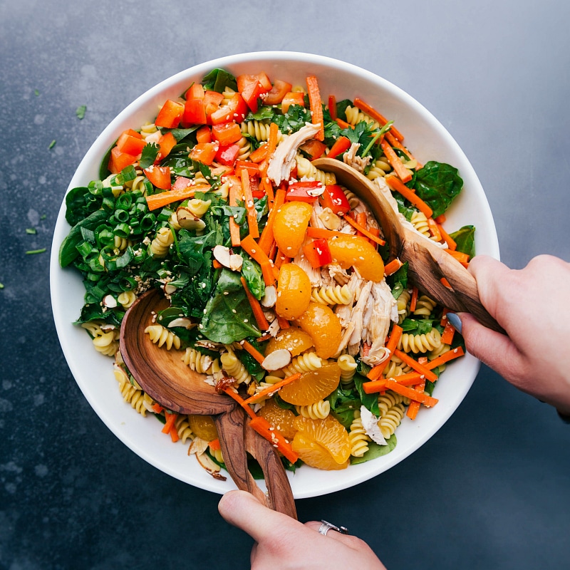 Image of the salad being tossed together.