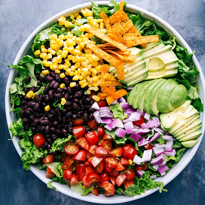 Overhead image of all the components of BBQ Chicken Salad recipe.