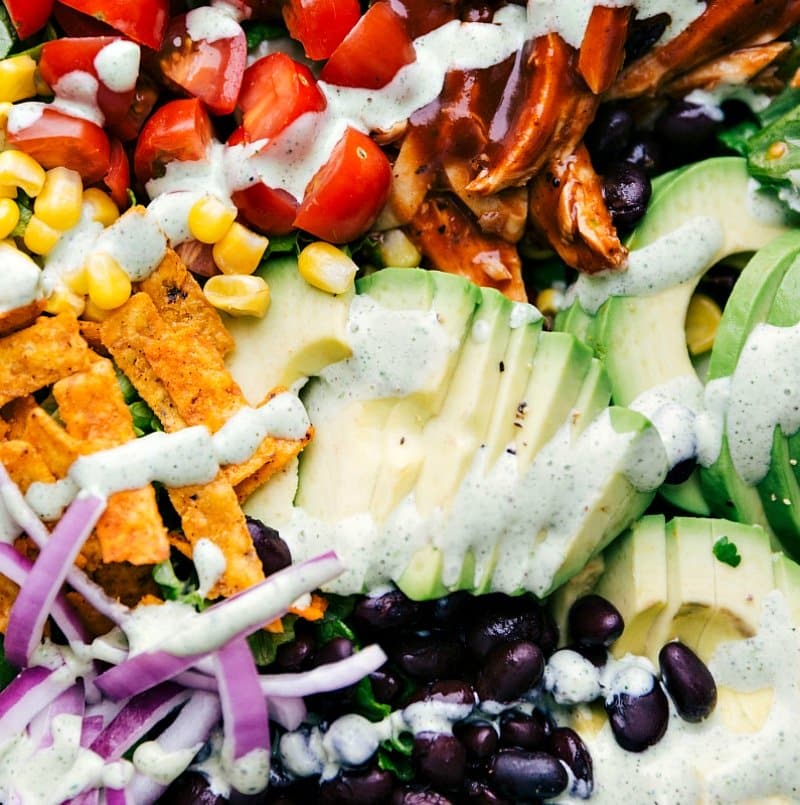 Up-close overhead image of the different components of this salad, freshly dressed.