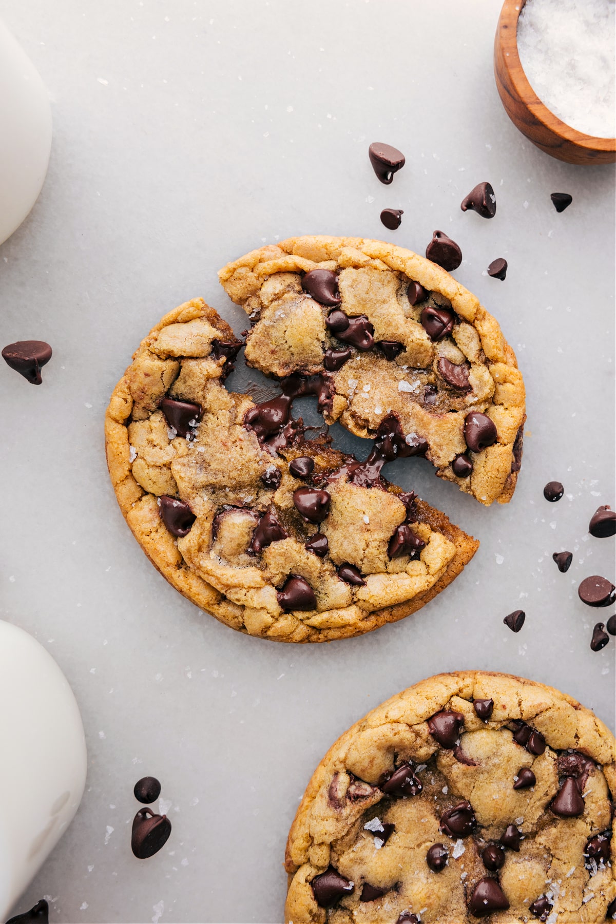 Single serve chocolate chip cookie recipe broken apart showing the gooey, delicious inside.