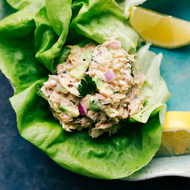 Image of the Avocado Tuna Salad in a lettuce wrap ready to be eaten.