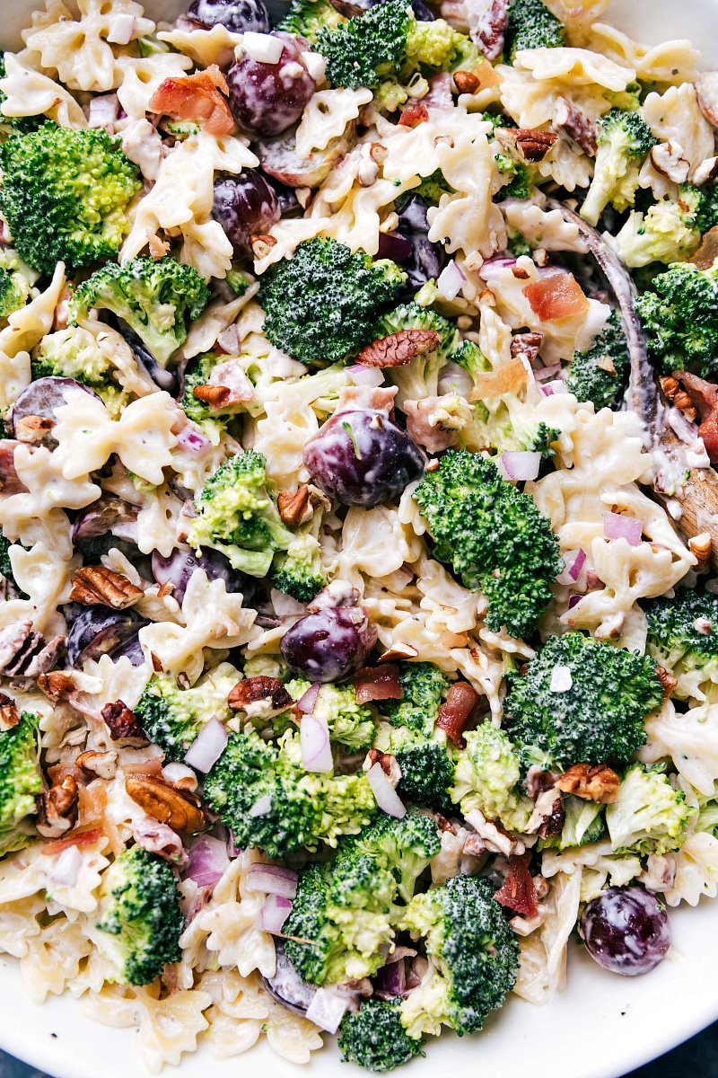 Overhead image of Broccoli Grape Pasta Salad in a bowl with a spoon in it.