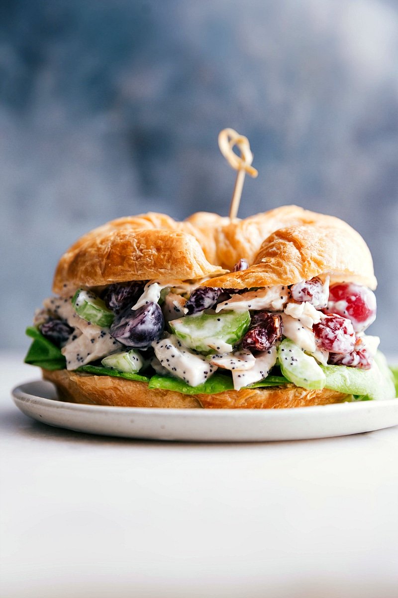 Up-close image of Healthy Chicken Salad on a croissant, ready to be eaten.