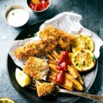 ONE PAN easy fish and chips -- the crispiest baked fries you'll ever eat and delicious fish! Simple prep. via chelseasmessyapron.com