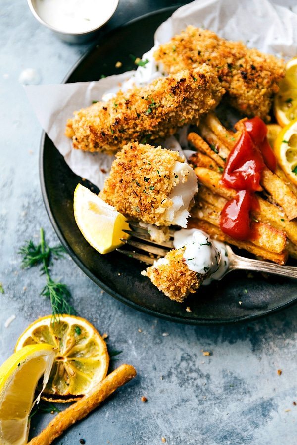 ONE PAN easy baked fish and chips -- the crispiest baked fries you'll ever eat and delicious fish! Simple prep.