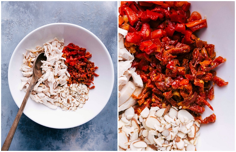 Mixing chicken, slivered almonds, roasted red peppers, and tomatoes in a bowl for pesto chicken salad.