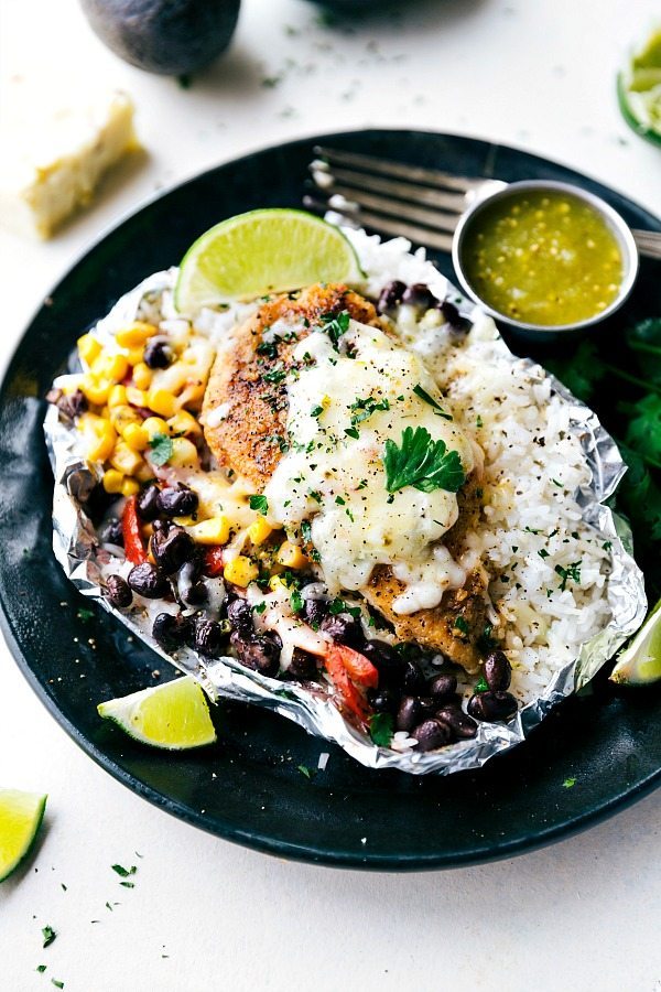 EASY FOIL PACKET Creamy salsa verde chicken with rice and veggies all cooked at once in a foil packet! No need to pre-cook the rice or chicken. This dish takes no more than 10 minutes to assemble and is bursting with delicious Mexican flavor! Also, make these packets into TACOS for another quick and easy dinner. Recipe from: chelseasmessyapron.com