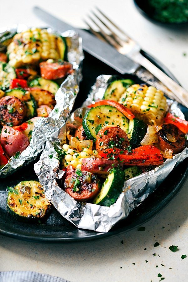 These delicious and easy tin foil packets are so quick to assemble! They are packed with sausage, tons of veggies, and the best seasoning mix. Recipe via chelseasmessyapron.com