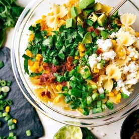 A delicious Mexican Street Corn Pasta salad with tons of veggies and a simple creamy dressing. Recipe from chelseasmessyapron.com
